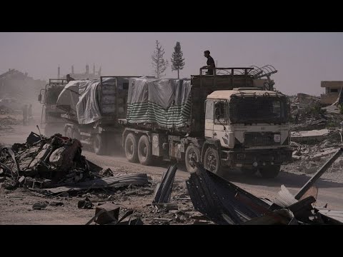YouTube video thumbnail: Humanitarian Aid Trucks Roll Into Gaza Amid Fragile Ceasefire