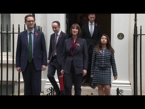 UK Chancellor poses with tradition red case ahead of budget unveiling | AFP