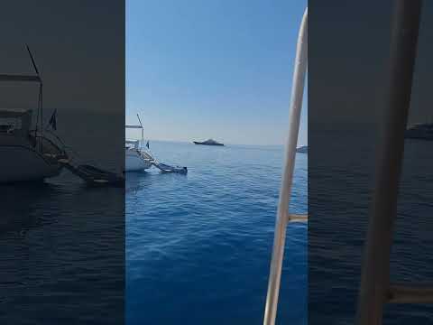 Corfu Old Fortress and the very old British Military Hospital from an excursion boat in Garitsa Bay