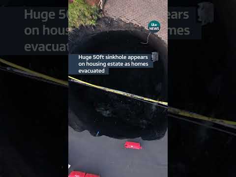 Huge 50ft sinkhole appears on housing estate as homes evacuated #itvnews #wales