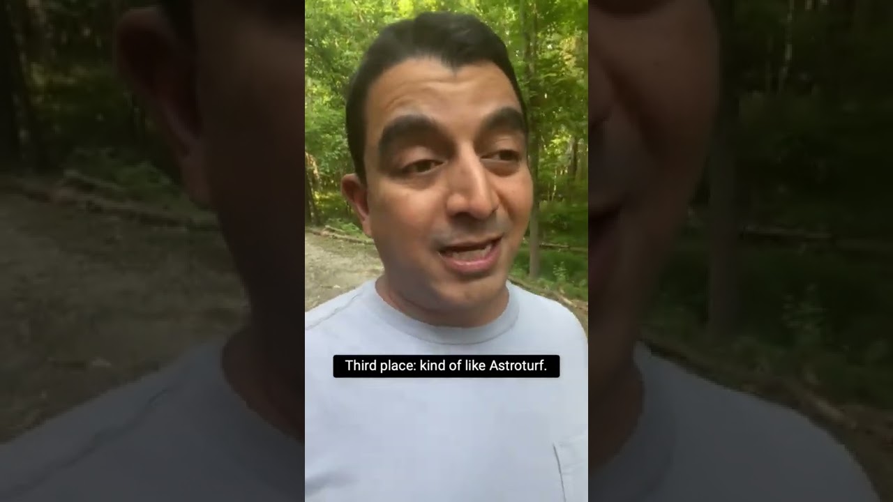 Person speaking outdoors about Astroturf competition.