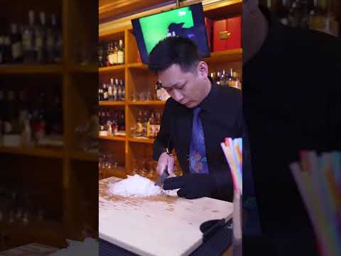 Heart of Africa The bartender uses ice to cut out the heart of Africa to make a cup of bright an