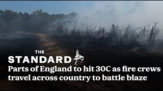 Parts of England to hit 30C as fire crews travel across country to battle blaze