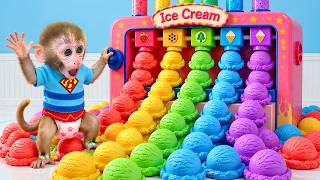 Monkey Baby Bon Bon and the puppy are enjoying a colorful ice cream together.