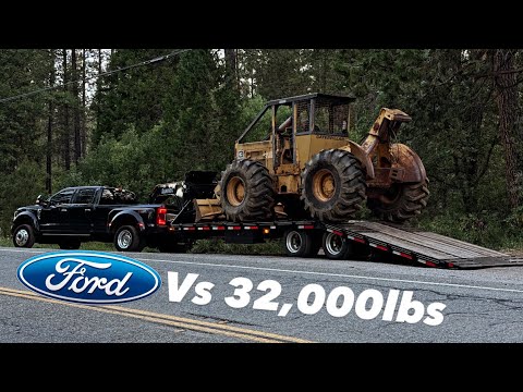 This Truck is IMPRESSIVE! Ford F-450 towing CAT SKIDDER!!