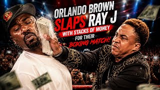 Orlando Brown Slaps Ray J with stacks of money in face off for Upcoming boxing match 