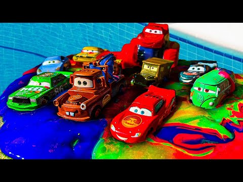 Disney Pixar Cars fall into the water: Lightning McQueen, Chick Hicks, Jackson Storm, Mater