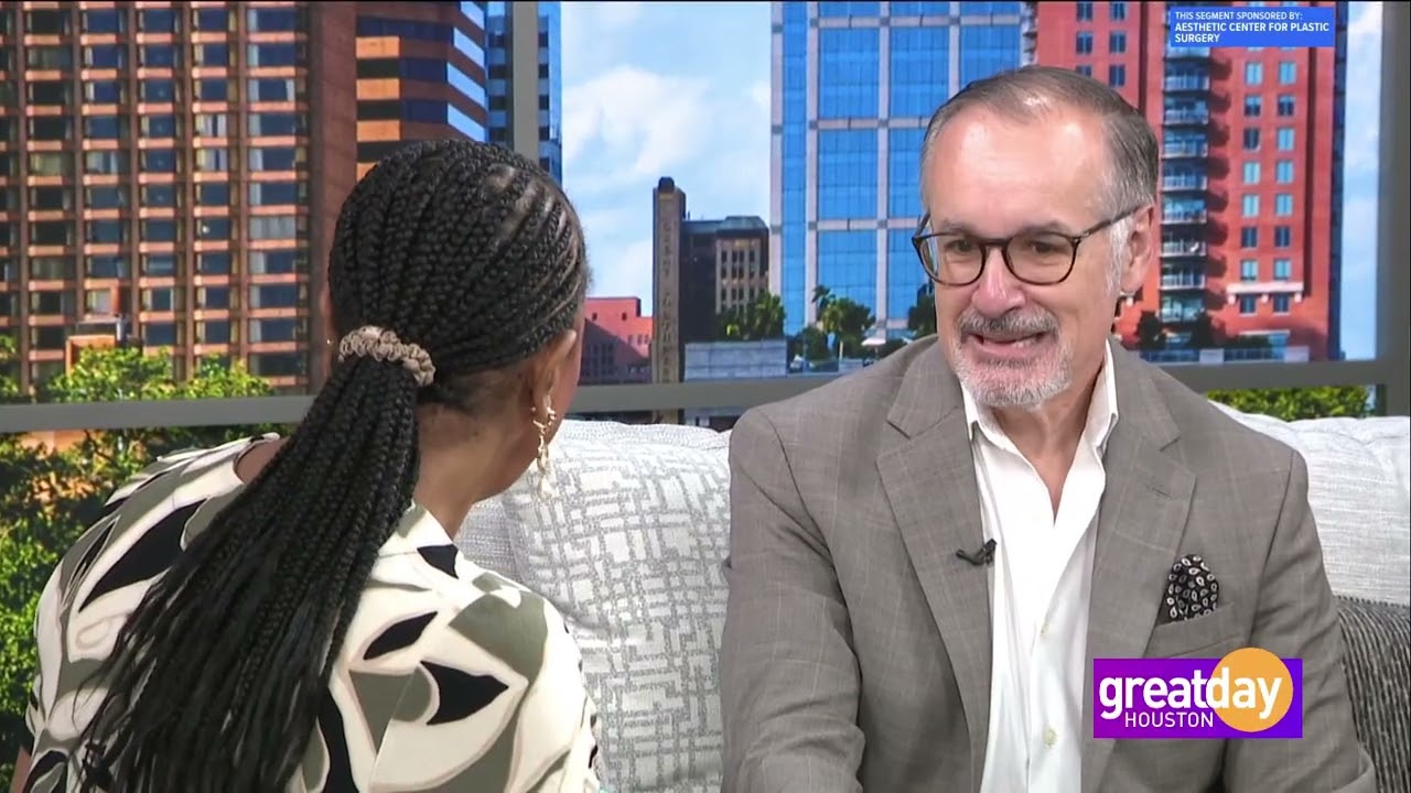 Interview segment on a talk show set.
