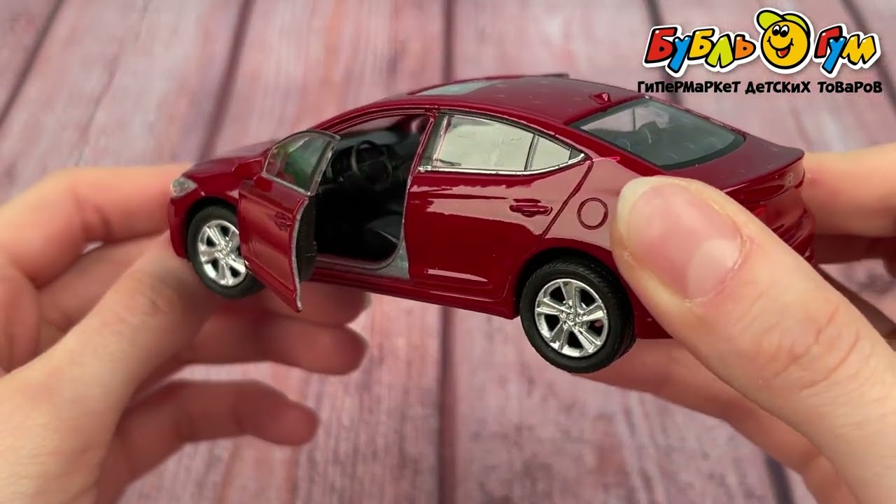 Машинка Hyundai Elantra Welly металлическая инерционная 1:38  - видео