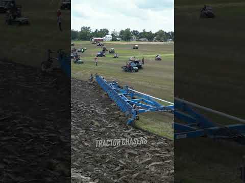 DMI 21 Bottom Plow and Big Bud Tractor