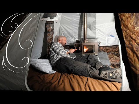 Man Sleeps in a Hot Tent with Wood Stove