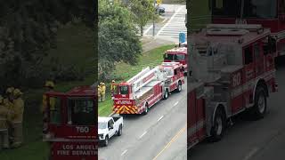 LA Truck Dangles over River
