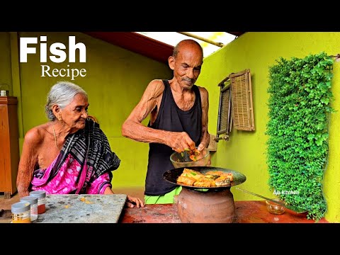 Grandma and grandpa enjoy cooking fish together and savor eating it too!