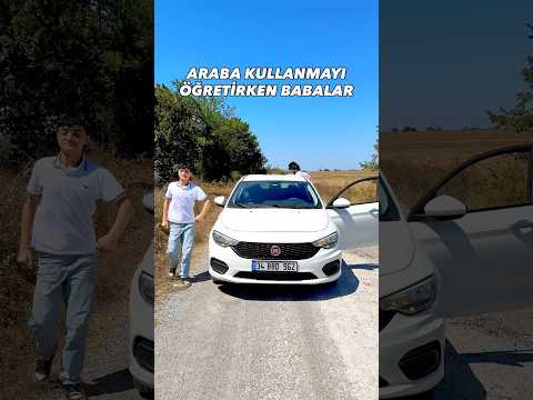 Araba kullanmayı öğretirken babalar