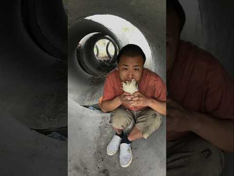 a homeless man is eating