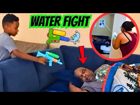 Spraying WATER In HIS FACE With A SUPER SOAKER 🔫 WHILE HE SLEEPS! (HILARIOUS)
