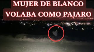 Mujer de blanco volaba sobre las tierras 