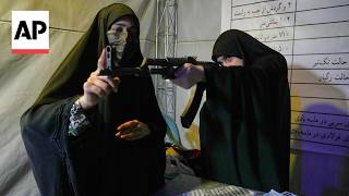 YouTube video thumbnail: Iran Residents Learn to use Guns in Case of a US Ground Invasion