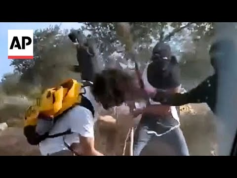 YouTube video thumbnail: Israeli Settlers Attack Palestinian Olive Harvesters and Activists in the West Bank