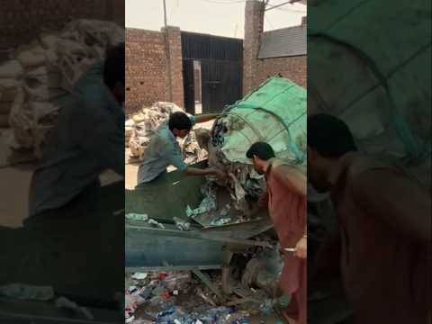 Thousands of plastic cans recycled and turned into large plastic tubes.