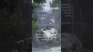 Train crashes into truck carrying septic tank