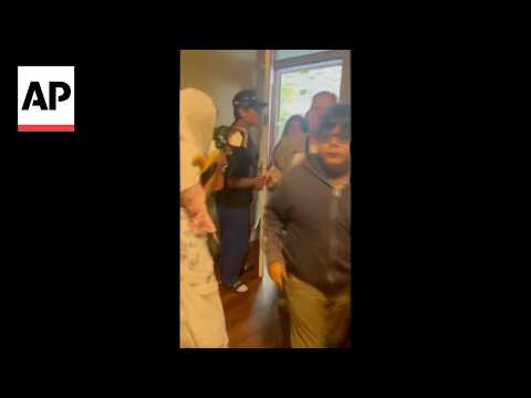 Video shows people seeking shelter in a home after Seattle shooting