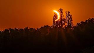 YouTube video thumbnail: Hikers in Awe as Solar Eclipse Turns sky red Over French Pyrenees