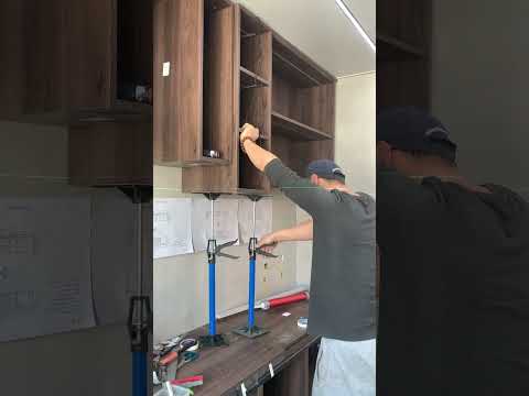Such satisfaction when the cabinet meets the leveling line. 3rd hand supporter. Link below