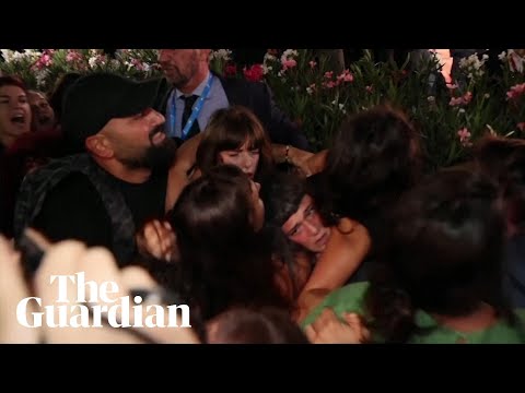Protesters clash with security over Woody Allen allegations at Venice film festival