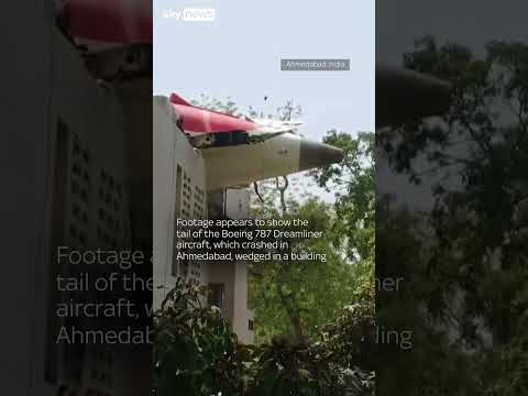 Tail of Air India plane wedged in roof following crash in Ahmedabad