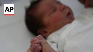 YouTube video thumbnail: 54-Year-old Greek Woman Gives Birth to Baby From Embryo Frozen for 22 Years
