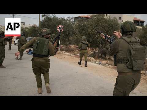Israeli settlers attack West Bank olive harvesters and set vehicles ablaze