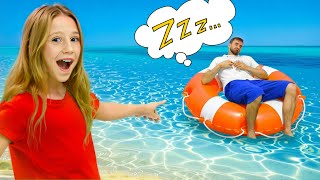 Nastya has a picnic party with her friend while her dad naps nearby