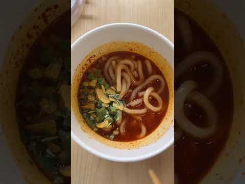 Spicy garlic tteokbokki, pollack roe mayo kimbap, and hetban meal at a Korean convenience store.