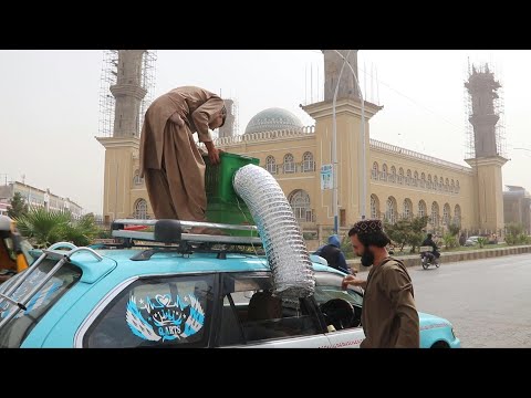 Afghanistan taxi drivers turn to handmade coolers to beat the heat | AFP
