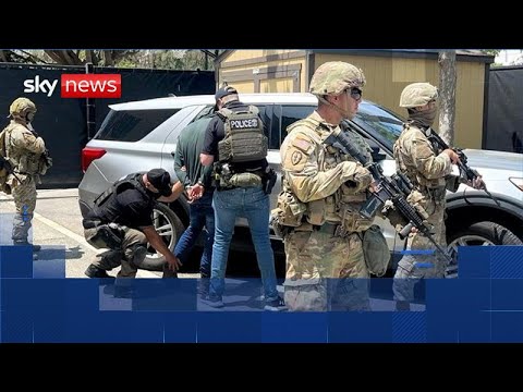 Riot police and National Guard set to enforce LA curfew as violence continues