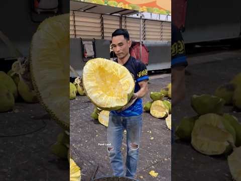Giant jackfruit sliced with skill. 🔪