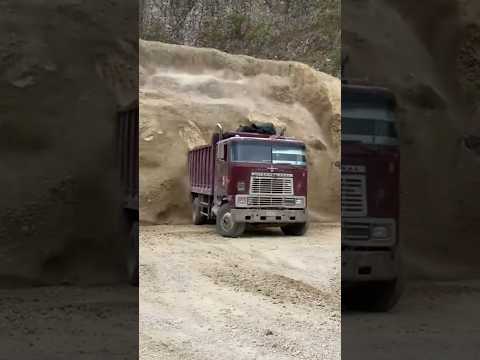 The truck is stuck in crushed materials. Watch the video to see how it was removed.