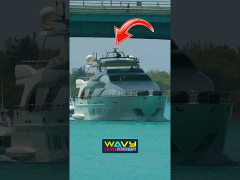 Yacht crew rushes to lower antenna to clear the Haulover Bridge | Wavy Boats