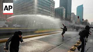 YouTube video thumbnail: Police use Water Cannon During Clashes With Student Protesters in Chile