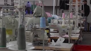 YouTube video thumbnail: South African Clothing Factories Struggle as Migrant Workers Flee