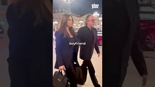 Monica carries the bags. Tim carries... nothing