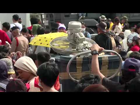 YouTube video thumbnail:  Cambodians Cross Thai Border to Return Home