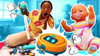 What a mess in the baby doll's house! A toy robot vacuum cleaner for the baby doll.