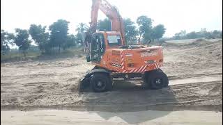 The excavator is on working and loading soil on the Trolley. @TractorsWalay