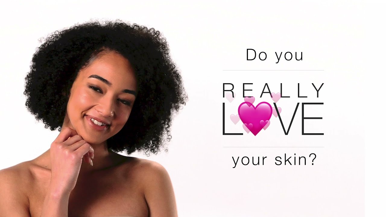 Woman promoting skin love message with hearts.