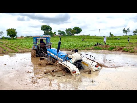 New holland tractor stuck in mud Rescued by another new holland tractor | tractor |