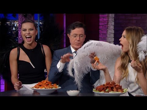 Stephen Colbert Feeds Buffalo Wings To Victoria's Secret Angels -- And ALL HELL Breaks Loose! Watch!
