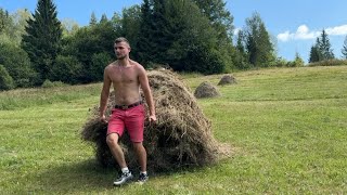 Hard work with hay in the mountains under the scorching sun