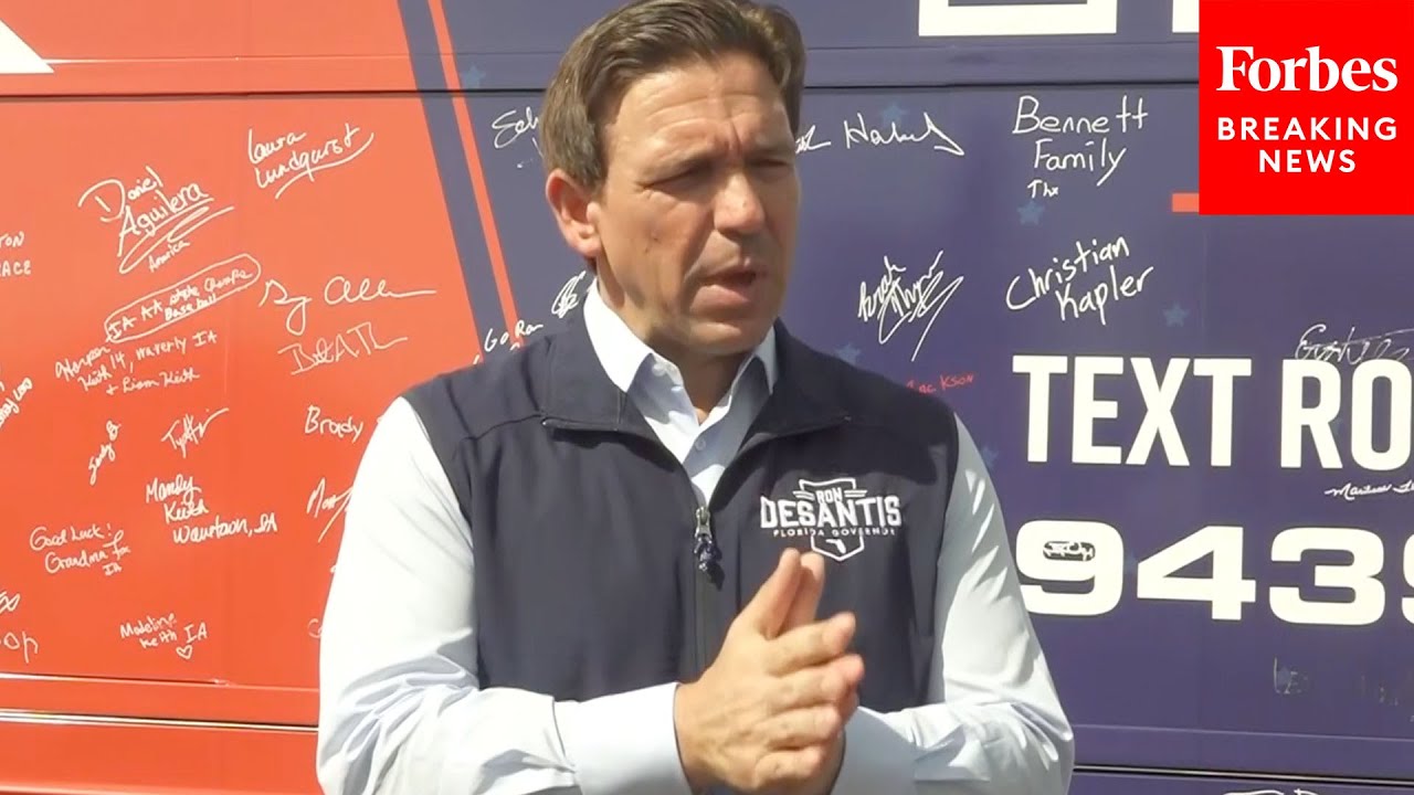 Gov. Ron DeSantis (R-FL) speaks to reporters in Algona, Iowa.